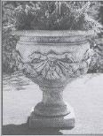 Vaso con fiocco e ghirlande